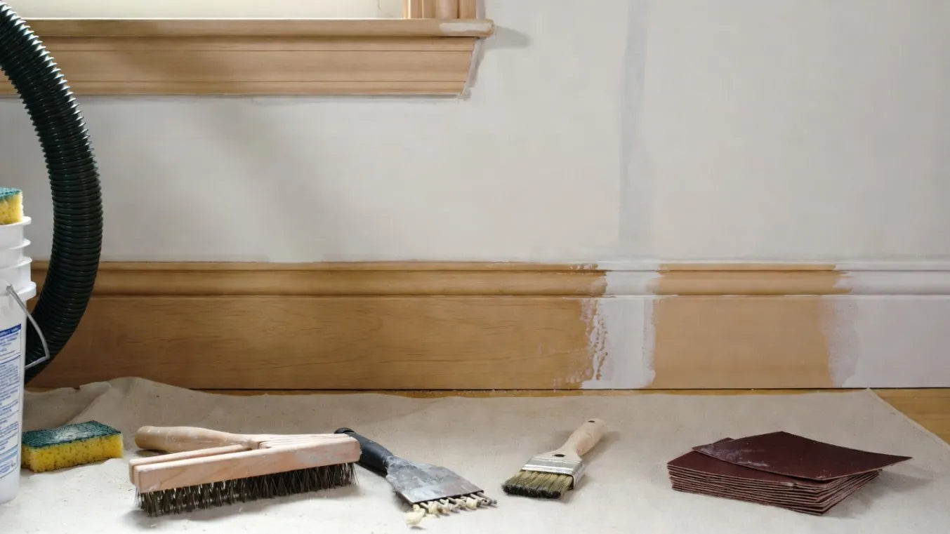 Process: Dust/vacuum, wash with TSP or mild degreaser, scrape loose/flaking paint, sand (120–220 grit), fill dents/cracks with spackle or wood filler, sand smooth, caulk gaps, prime bare or stained areas.