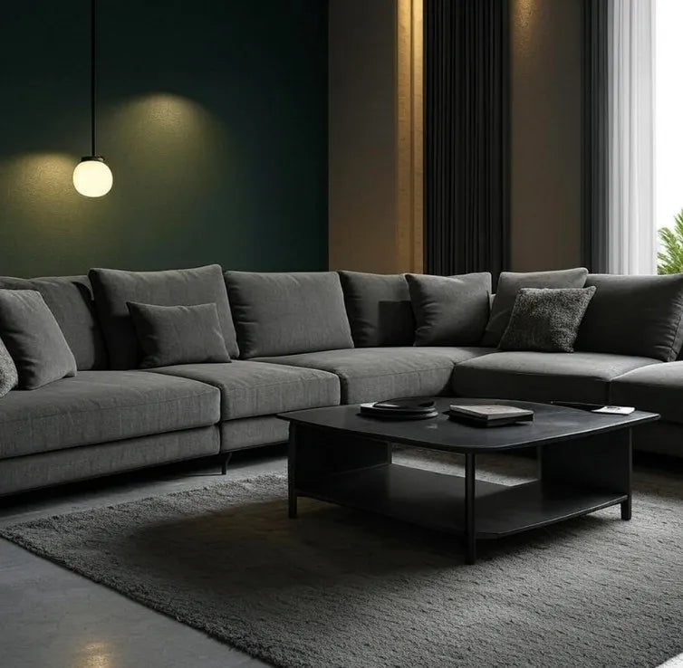Modern living room with a gray sectional sofa and dark coffee table.
